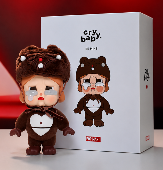 POP MART CRYBABY Be Mine Limited Edition 17cm collectible figure in brown bear costume displayed beside original illustrated presentation box