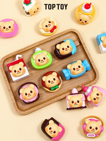 TOP TOY Butterbear Afternoon Tea miniature magnetic figures displayed on a wooden tray, featuring colourful bear-shaped chocolates, cakes, sweets and dessert designs.