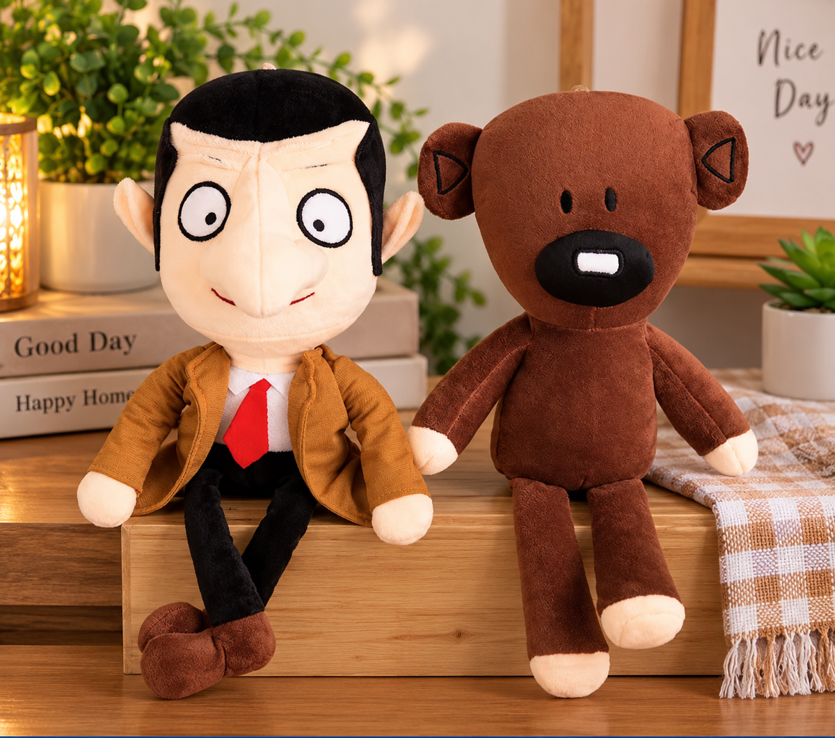 Mr Bean plush toy wearing his signature brown jacket and red tie alongside his brown Teddy bear plush.