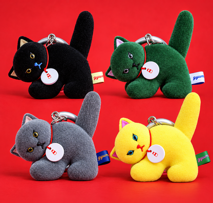 Gyunyuya Japanese designer cat mascot collection featuring four flocked cat bag charms in black, green, grey and yellow.