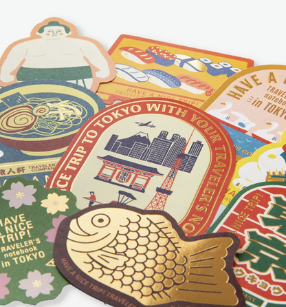 Close-up of TRAVELER'S COMPANY Tokyo Edition Japanese stickers showing detailed illustrations, vintage-inspired colours and decorative gold foil finishes.