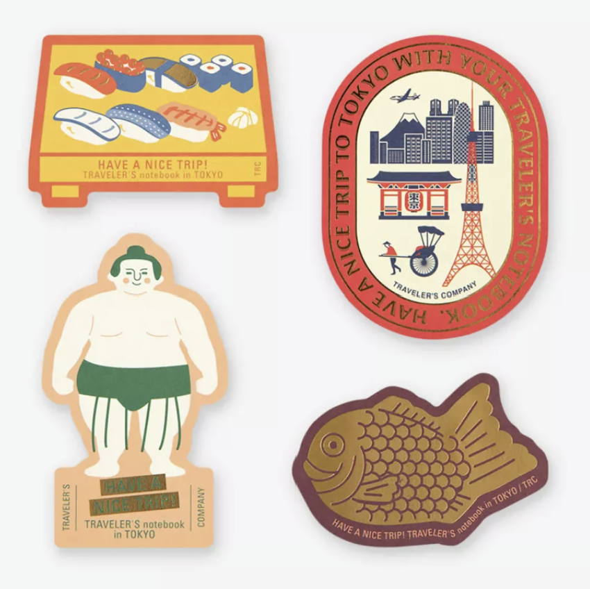 Four Tokyo Edition stickers featuring Japanese sushi, Tokyo Tower and skyline, traditional sumo wrestler and gold foil taiyaki fish.