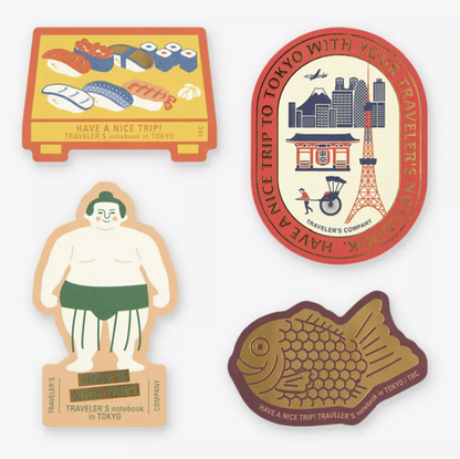 Four Tokyo Edition stickers featuring Japanese sushi, Tokyo Tower and skyline, traditional sumo wrestler and gold foil taiyaki fish.