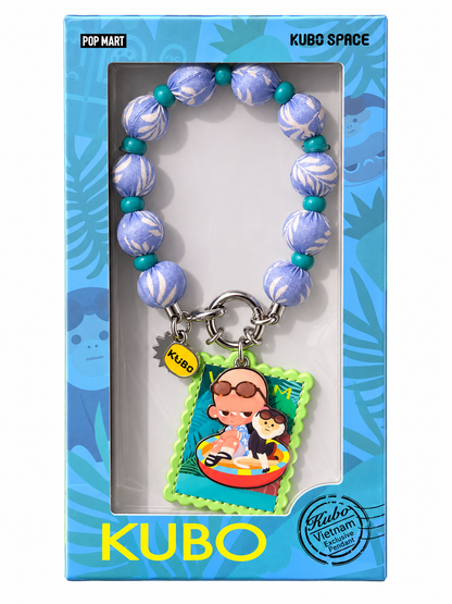 Official POP MART KUBO SPACE Vietnam Exclusive beaded bag charm displayed in original blue presentation box with tropical design.