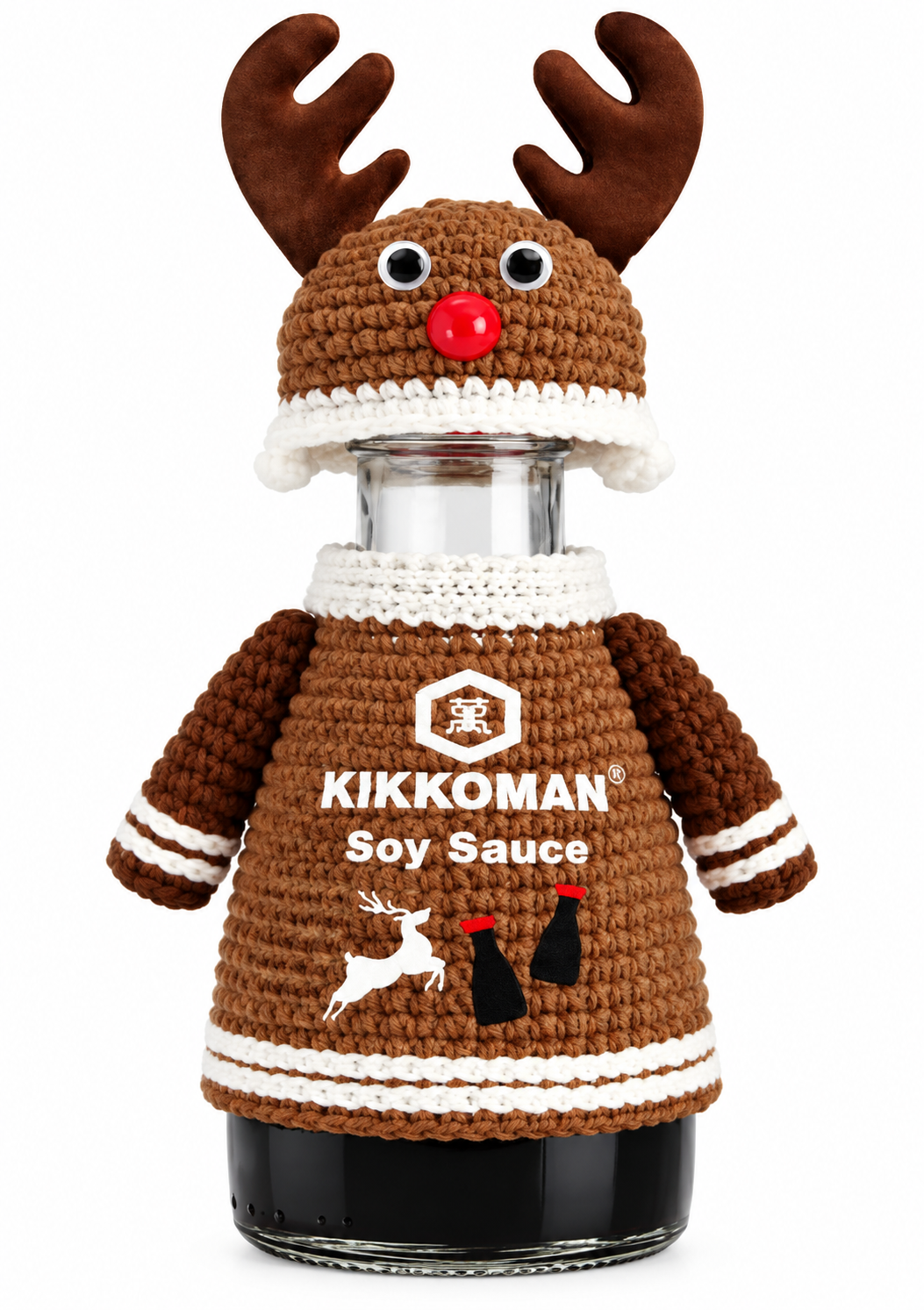Kikkoman Christmas 2026 limited-edition reindeer soy sauce bottle featuring brown knitted-style jumper with Kikkoman branding, matching antler hat, googly eyes and red nose.