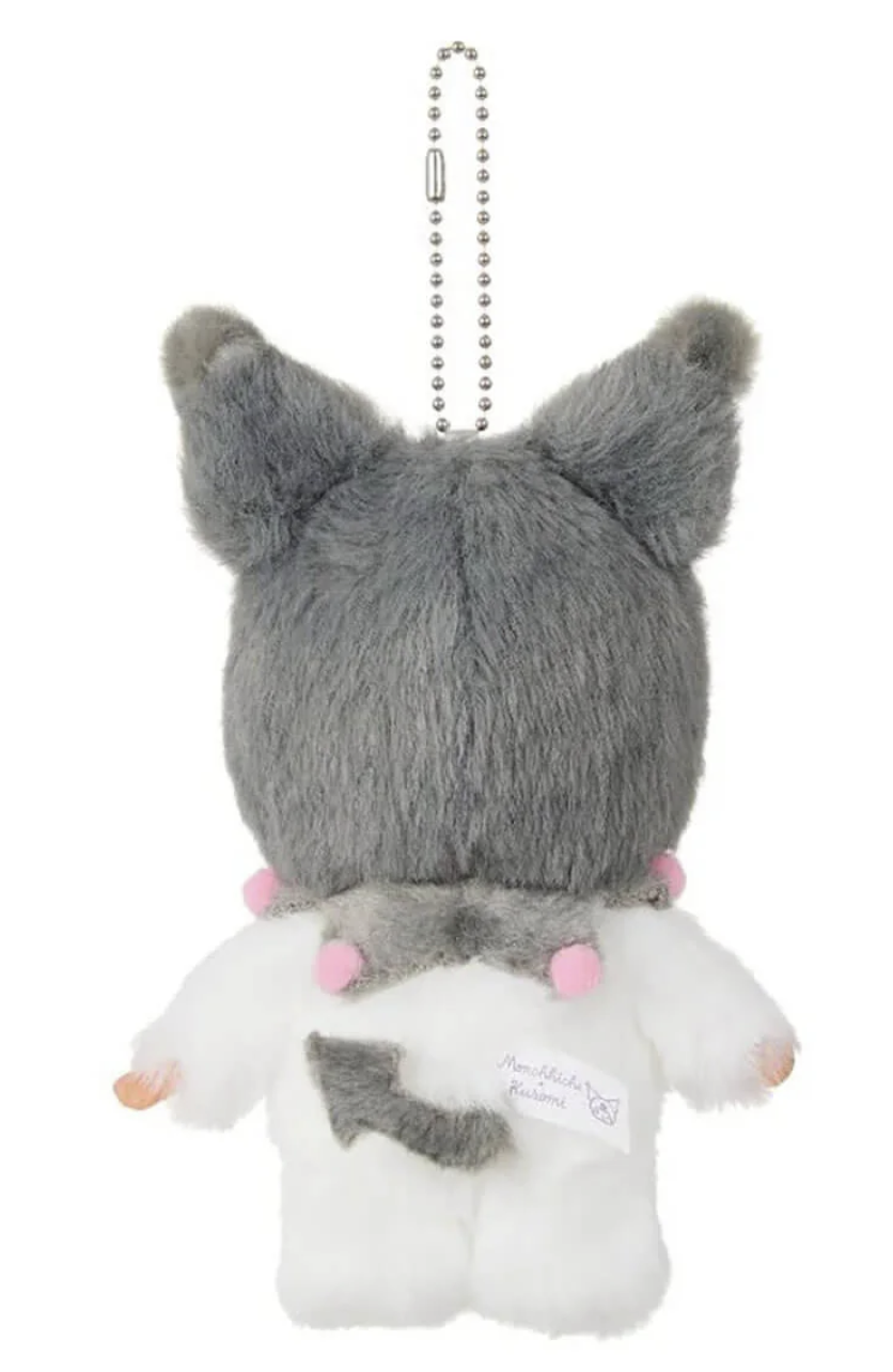 Back view of Monchhichi x Kuromi plush mascot showing grey hood, white plush body, tail and official collaboration tag.