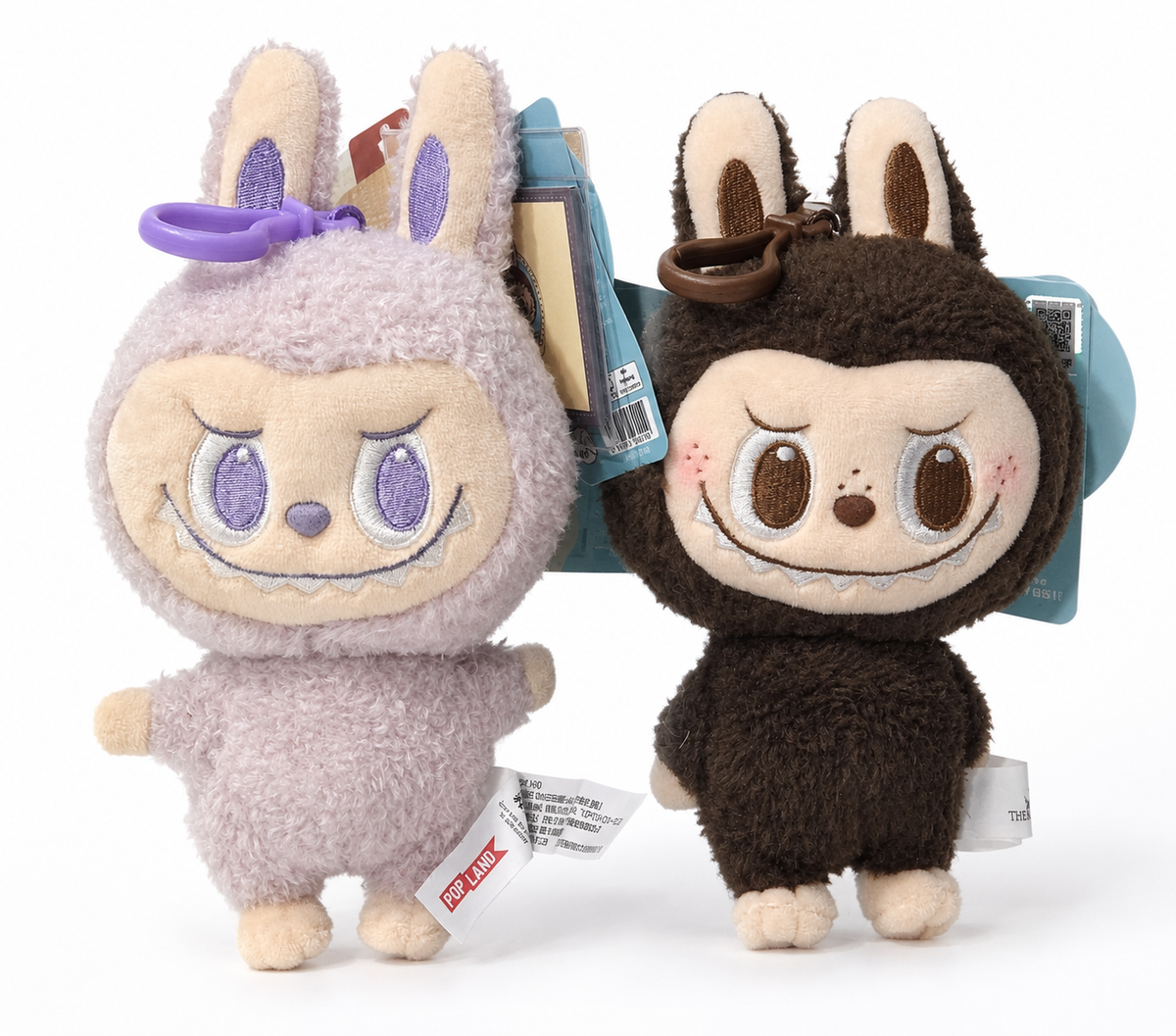 Purple and brown POP MART Labubu POP LAND Classic plush pendants with embroidered faces and matching hanging clips.