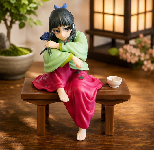 Maomao The Apothecary Diaries PVC figure seated on wooden bench with green top and pink skirt