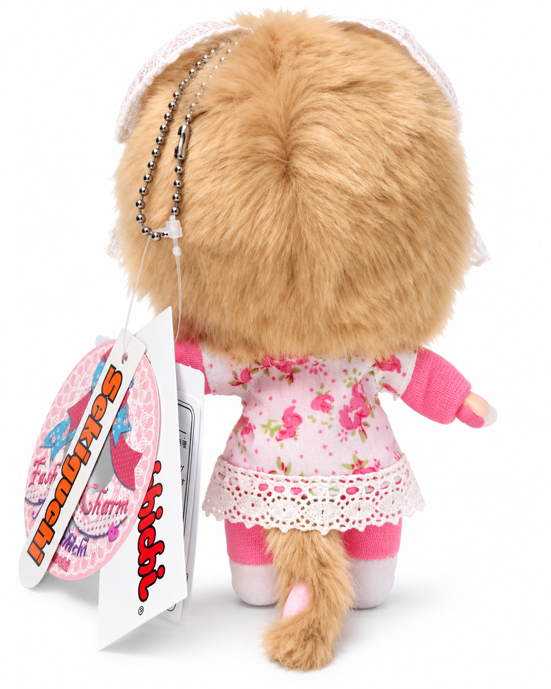 Rear view of Sekiguchi Monchhichi Pink Drop Fashion Charm showing floral outfit, lace trim, plush tail and original tags