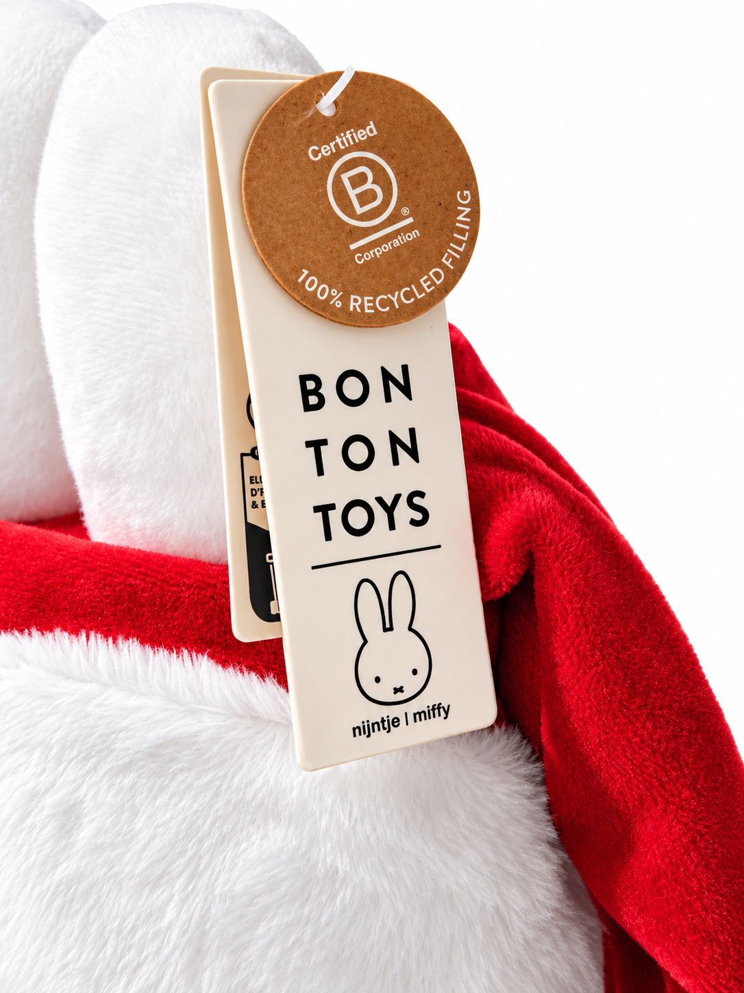 Close-up of the official Bon Ton Toys label attached to the Miffy Santa Claus Christmas plush, showing the manufacturer's branding and authenticity details.