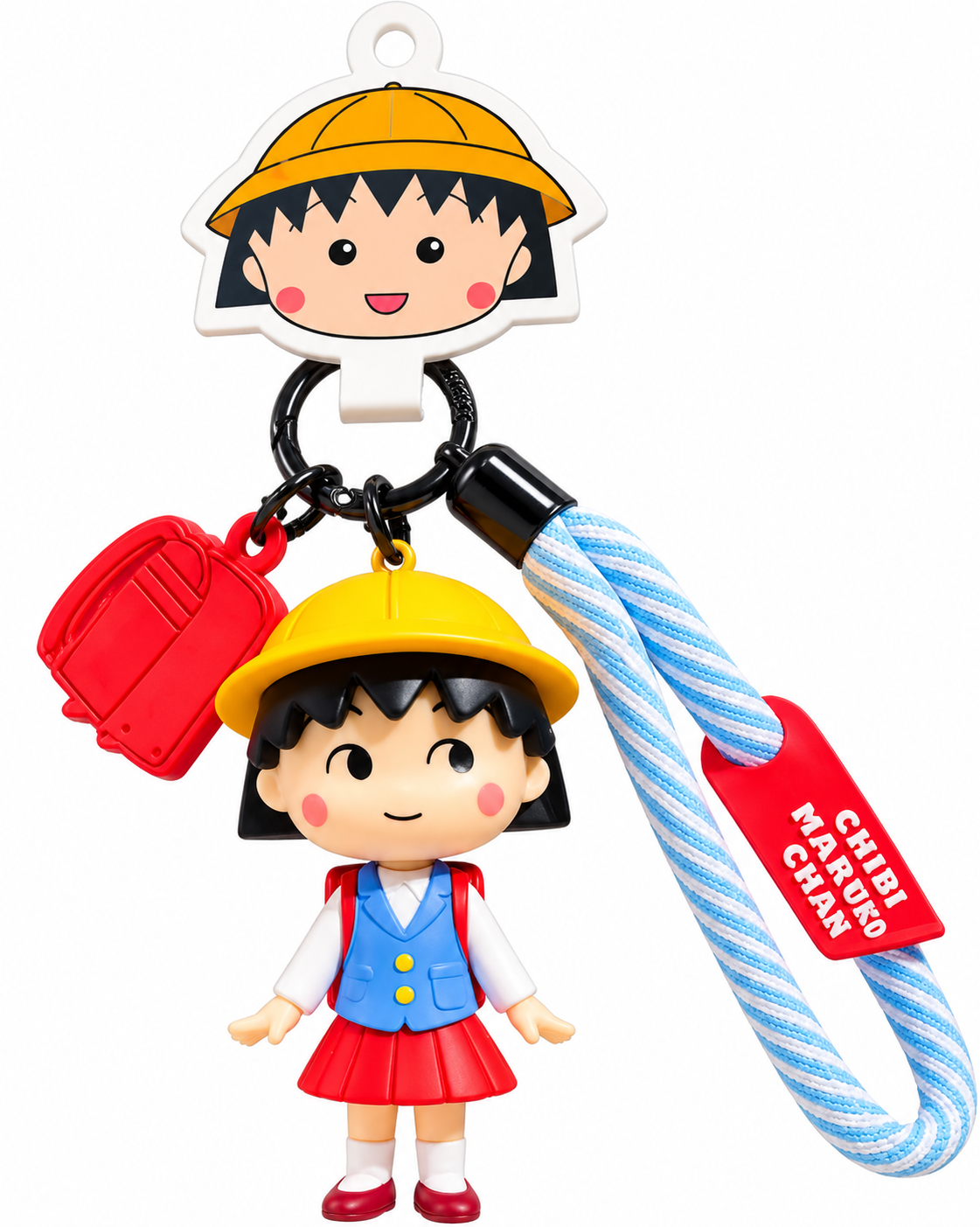Chibi Maruko Chan School Time figure keyring featuring Maruko in a yellow school hat, blue waistcoat and red skirt with miniature schoolbag charm and wrist strap.