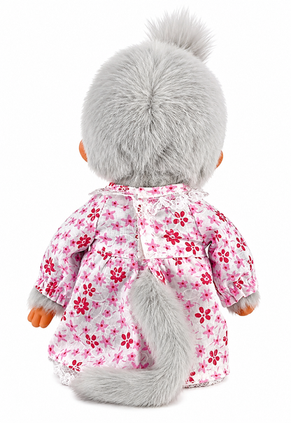Full-length Sekiguchi Monchhichi Grandma plush doll in pink floral dress and white lace apron
