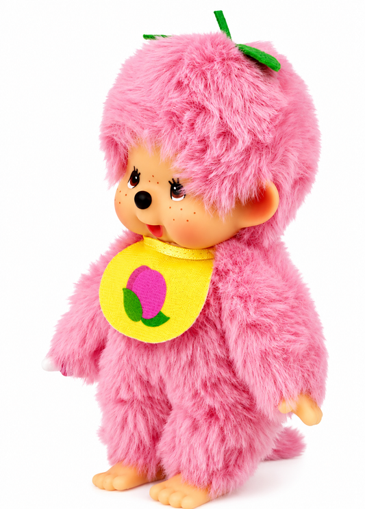 Sekiguchi Monchhichi Fruit Color Peach Pink plush shown at an angle with pastel-pink fur, yellow peach bib and green leaf head detail