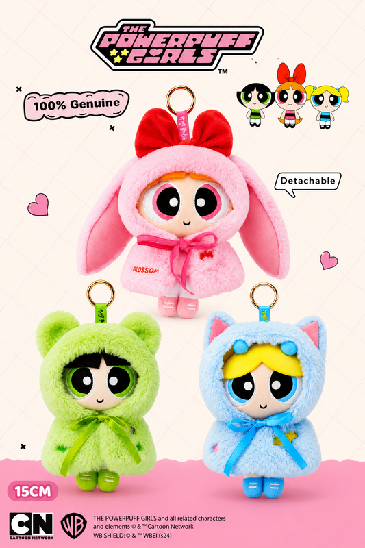 The Powerpuff Girls 15cm plush keychain bag charms featuring Blossom in a pink bunny hood, Buttercup in a green bear hood and Bubbles in a blue cat hood with detachable outfits.