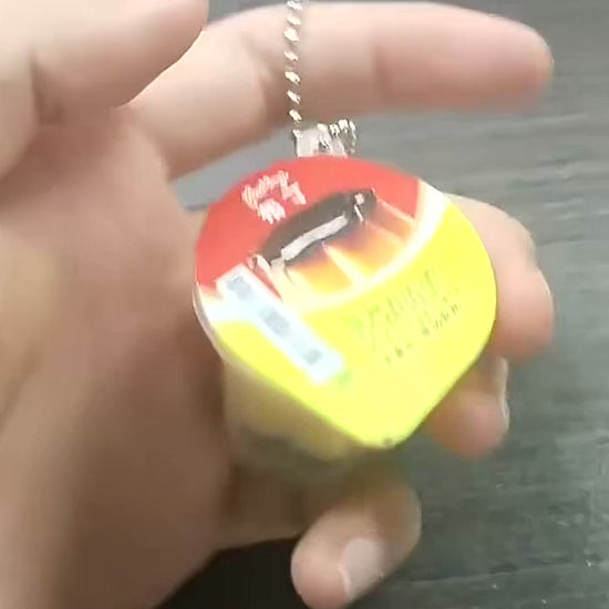 Video demonstrating Japanese-style pudding squishy keyrings, including opening the miniature cup and squeezing the soft pudding inside.