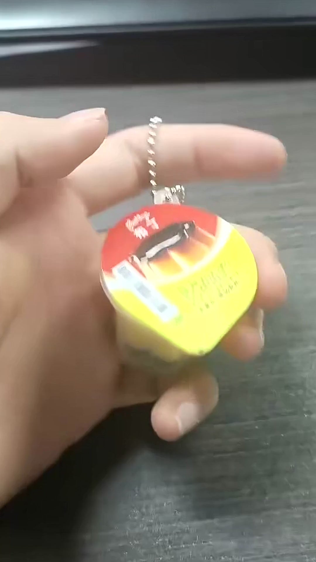 Video demonstrating Japanese-style pudding squishy keyrings, including opening the miniature cup and squeezing the soft pudding inside.