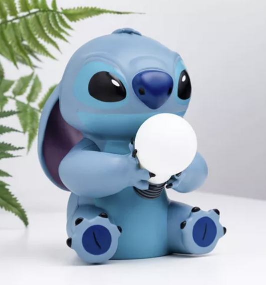 Disney Stitch 16cm decorative lamp by Paladone featuring Stitch sitting and holding an illuminated white light bulb.
